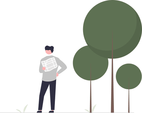 man reading a paper standing next to trees